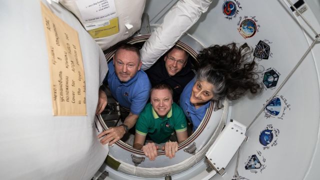NASA’s SpaceX Crew-9 members pose together for a portrait inside the vestibule between the International Space Station and the SpaceX Dragon crew spacecraft.