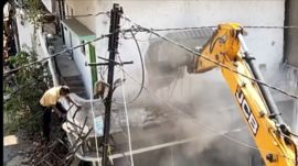 Civic authorities demolish the illegal portions of a house of Fahim Khan, a key accused in the Nagpur violence