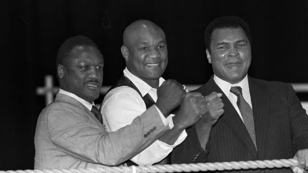 FILE PHOTO: Boxers Joe Frazier, George Foreman and Muhammad Ali, raise fists at launch of film Champions Forever exploring their lives London. (Reuters)