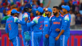 India's Varun Chakravarthy, second from right, celebrate the wicket of New Zealand's Will Young with his team mates during the ICC Champions Trophy cricket match between India and New Zealand at Dubai International Cricket Stadium in Dubai, United Arab Emirates, Sunday, March 2, 2025. (AP Photo)