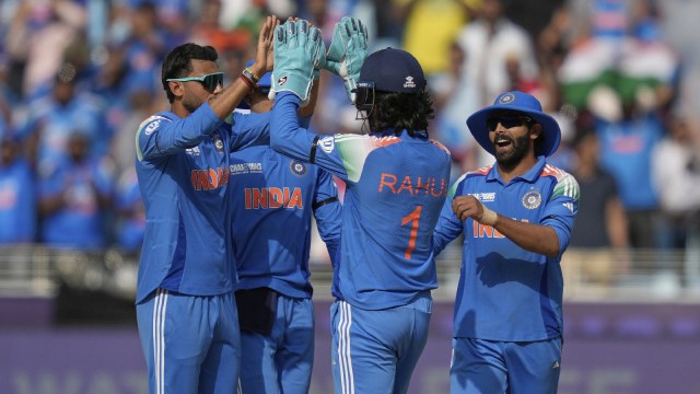 India's Axar Patel, left, celebrates with teammates after the dismissal of Australia's Glenn Maxwell during the ICC Champions Trophy semifinal cricket match between India and Australia at Dubai International Cricket Stadium in Dubai. (AP)