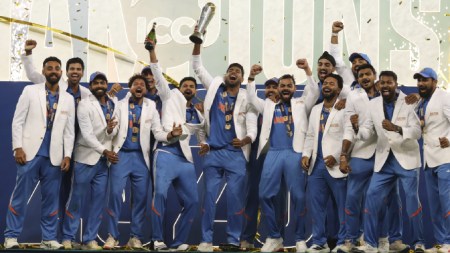 Indian players celebrate with the winners trophy on the podium after defeating New Zealand in the final cricket match of the ICC Champions Trophy at Dubai International Cricket Stadium in Dubai, United Arab Emirates. (AP)