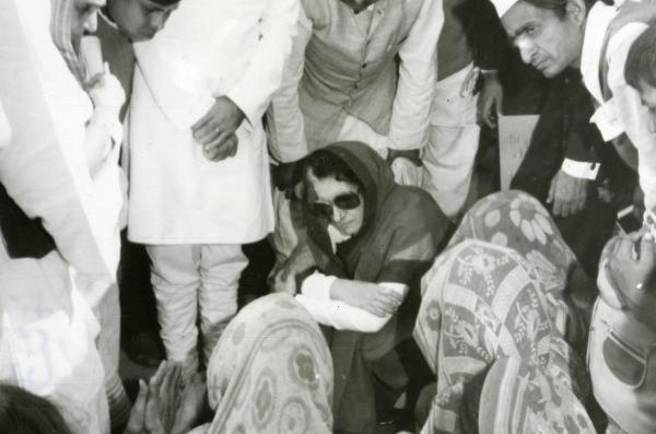 Prime Minister Indira Gandhi with survivors of the tragedy during her visit to the Dehuli village in Uttar Pradesh on November 27, 1981. Express Archive