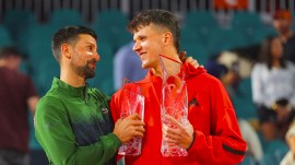 Jakub Mensik holds the Butch Buchholz Championship Trophy after defeating Novak Djokovic in the men's singles final at the Miami Open. (AP Photo)