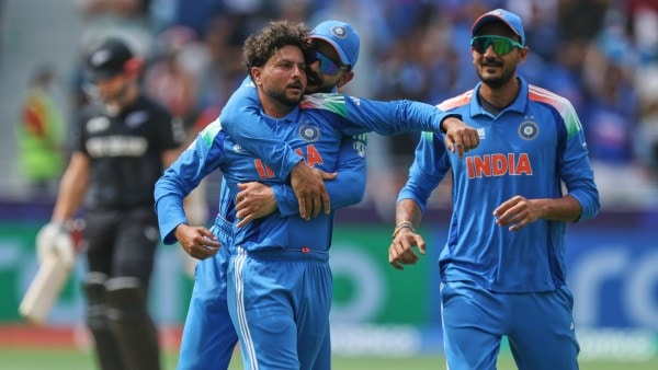 India’s Kuldeep Yadav, front, celebrates with teammate Virat Kohli after the dismissal of New Zealand's Kane Williamson during the ICC Champions Trophy final cricket match between India and New Zealand at Dubai International Cricket Stadium in Dubai, United Arab Emirates, Sunday, March 9, 2025. (AP Photo/Christopher Pike)