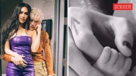 Machine Gun Kelly shares a tender moment with his newborn daughter