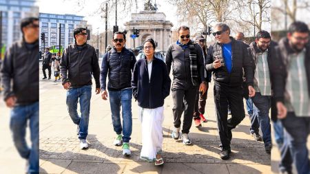 Mamata Banerjee walking backward in London.