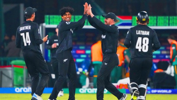 New Zealand's Rachin Ravindra (SECOND FROM LEFT) celebrates the wicket of South Africa's Aiden Markram with teammates like Mitchell Santner (LEFT) during the ICC Champions Trophy semi-final cricket match at the Gaddafi Stadium in Lahore. (AP Photo)