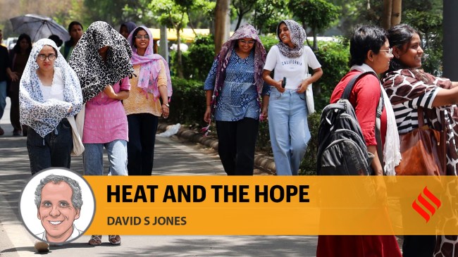 Women take cover under a scarf on a hot summer day amid heatwave, in New Delhi. (Source: Express Archives)