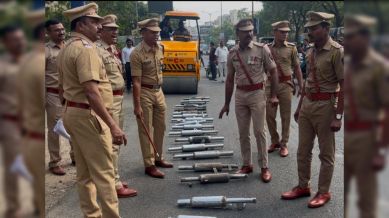 20 modified silencers of bullet bikes crest under road roller in Pune. (Express Photo)