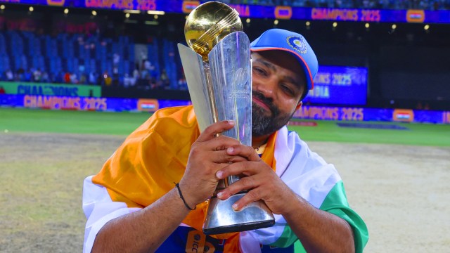 India's captain Rohit Sharma poses with the winners trophy after defeating New Zealand in the final cricket match of the ICC Champions Trophy at Dubai International Cricket Stadium in Dubai, United Arab Emirates, Sunday, March 9, 2025. (AP Photo)