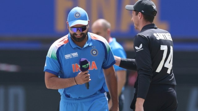 India's captain Rohit Sharma, left, and New Zealand's captain Mitchel Santner after the toss prior to the start of the ICC Champions Trophy final cricket match between India and New Zealand at Dubai International Cricket Stadium in Dubai, United Arab Emirates, Sunday, March 9, 2025. (AP Photo/Christopher Pike)