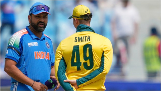 Rohit Sharma, left, speaks to Australia's captain Steve Smith at the toss ahead of the ICC Champions Trophy semifinal cricket. (AP Photo)