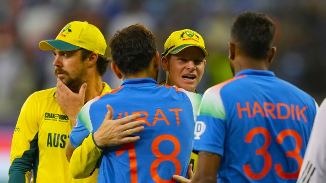 Australia's captain Steve Smith hugs India's Virat Kohli after India won against Australia during the ICC Champions Trophy semifinal cricket match at Dubai International Cricket Stadium in Dubai, United Arab Emirates, Tuesday, March 4, 2025. (AP Photo)