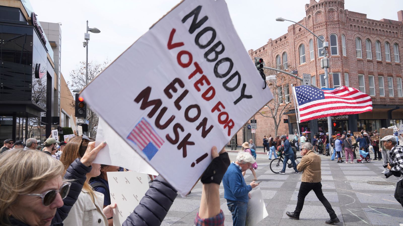 In photos: Protests erupt outside Tesla showrooms over Elon Musk’s US ...