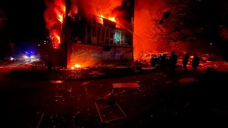 In this photo provided by the Ukrainian Emergency Service, firefighters put out the fire following a Russian rocket attack in Dobropillya, Donetsk region, Ukraine, Saturday, March 8, 2025. (Ukrainian Emergency Service via AP)