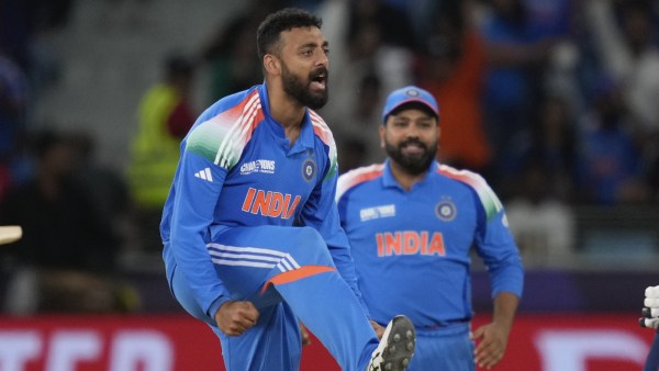 India's Varun Chakravarthy celebrate the wicket of New Zealand's Glenn Phillips during the ICC Champions Trophy cricket match between India and New Zealand at Dubai International Cricket Stadium in Dubai, United Arab Emirates. (AP)