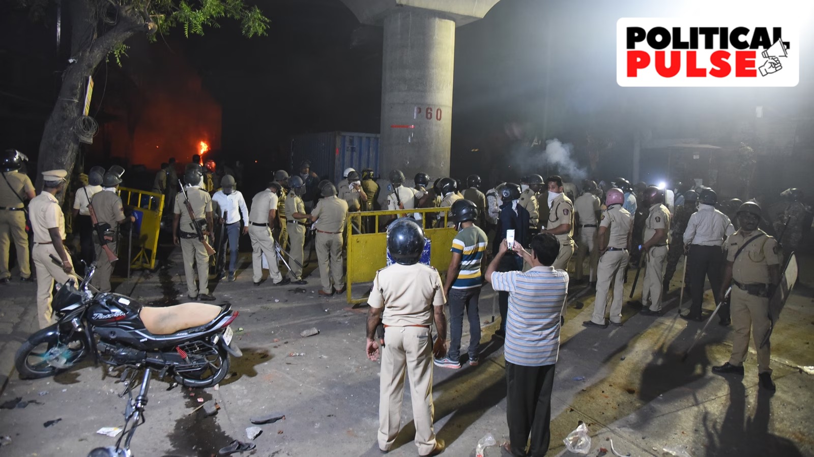 A road closed with barricades at Hansapuri area amid curfew after violence erupted on Monday night, in Nagpur, Tuesday. (PTI Photo)
