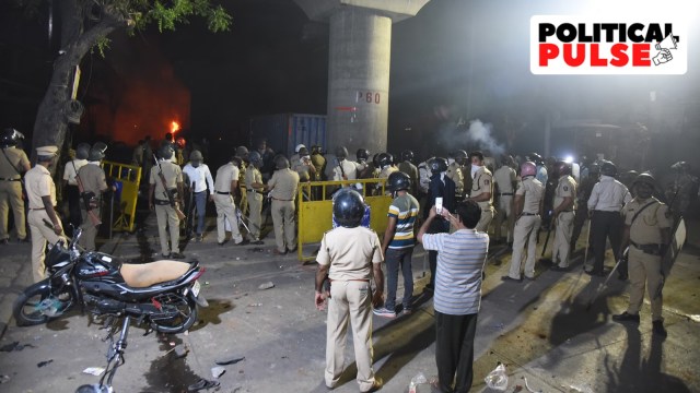 A road closed with barricades at Hansapuri area amid curfew after violence erupted on Monday night, in Nagpur, Tuesday. (PTI Photo)