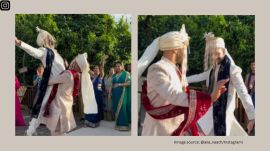 The gay couple is seen dancing with their loved ones in the video