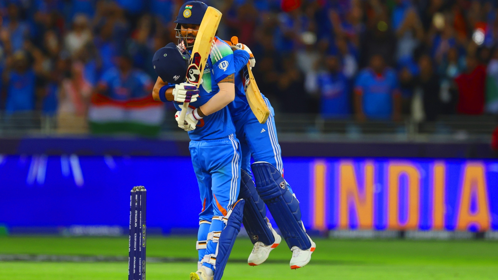 India's Ravindra Jadeja, left, hugs batting partner KL Rahul to celebrate their win in the ICC Champions Trophy final cricket match against New Zealand at Dubai International Cricket Stadium in Dubai, United Arab Emirates, Sunday, March 9, 2025. (AP Photo)