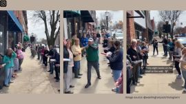 Volunteers lined the sidewalk in two rows, stretching from the old location to the new one. One by one, books were passed along