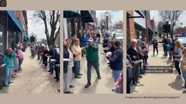 Volunteers lined the sidewalk in two rows, stretching from the old location to the new one. One by one, books were passed along