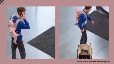 He checks the stroller and begins to call someone on the mobile phone