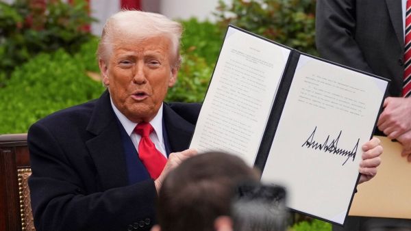 President Donald Trump holds a signed executive order during an event to announce new tariffs in the Rose Garden of the White House, Wednesday, April 2, 2025, in Washington. (Photo: AP/PTI)