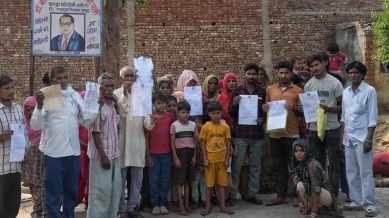 hapur eviction notice, PMAY, PMAY houses, Hapur eviction notice to Dalits, Dalits in PMAY homes, Garhmukteshwar illegal occupation, hapur land dispute, urban poor, PMAY housing scheme, Indian express