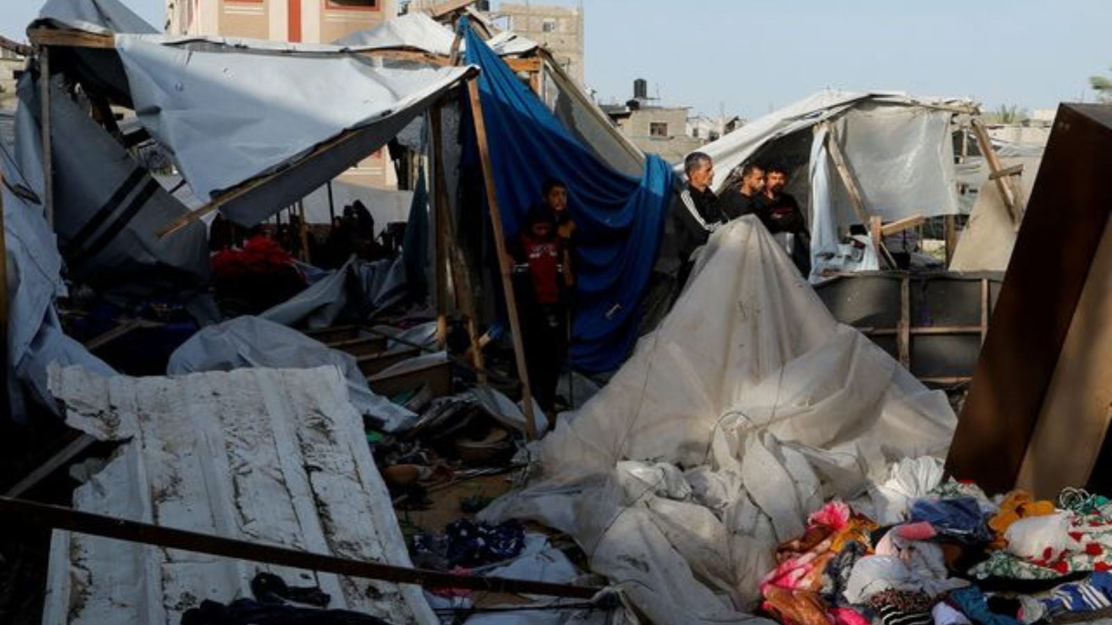 Palestinians gather at the site of an Israeli strike on a tent site