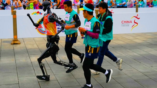 A robot takes part in what is billed as the world's first robot half marathon during the Humanoid Robot Half-Marathon held in Beijing on Saturday, April 19, 2025. (AP Photo)