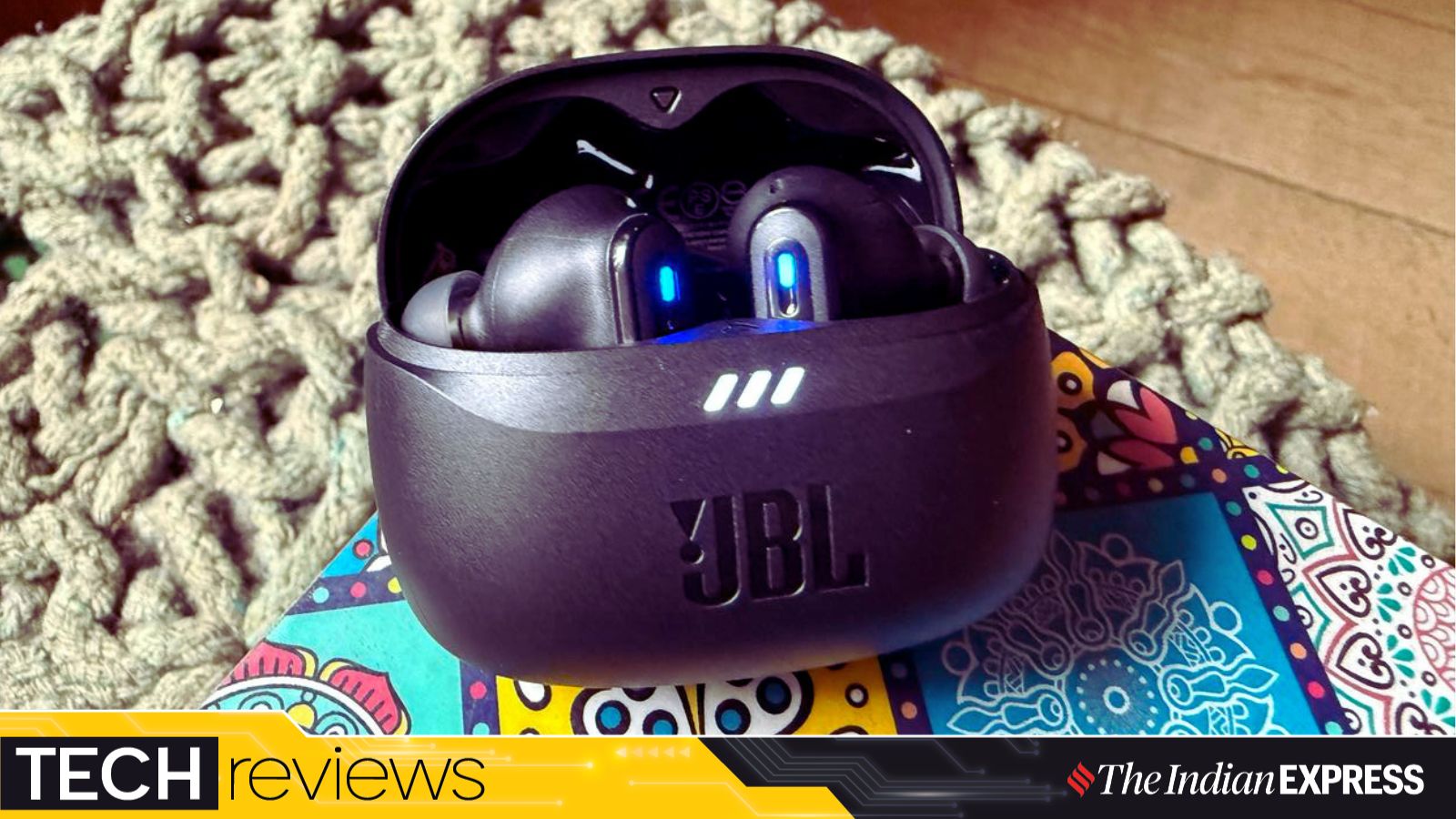 The JBL Tune Beam 2’s compact case and classic earbuds pack serious audio power into a small, stylish frame. (Image: Nandagopal Rajan/The Indian Express)