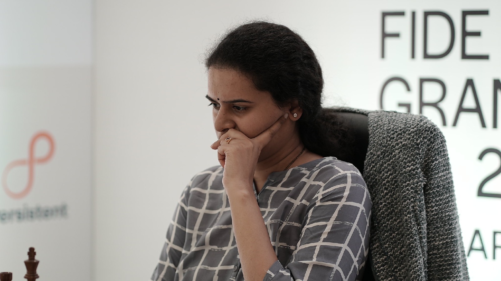 Koneru Humpy contemplates her next move at the Pune leg of the FIDE Grand Prix chess event. (PHOTO: Abhilash Shinde via FIDE)