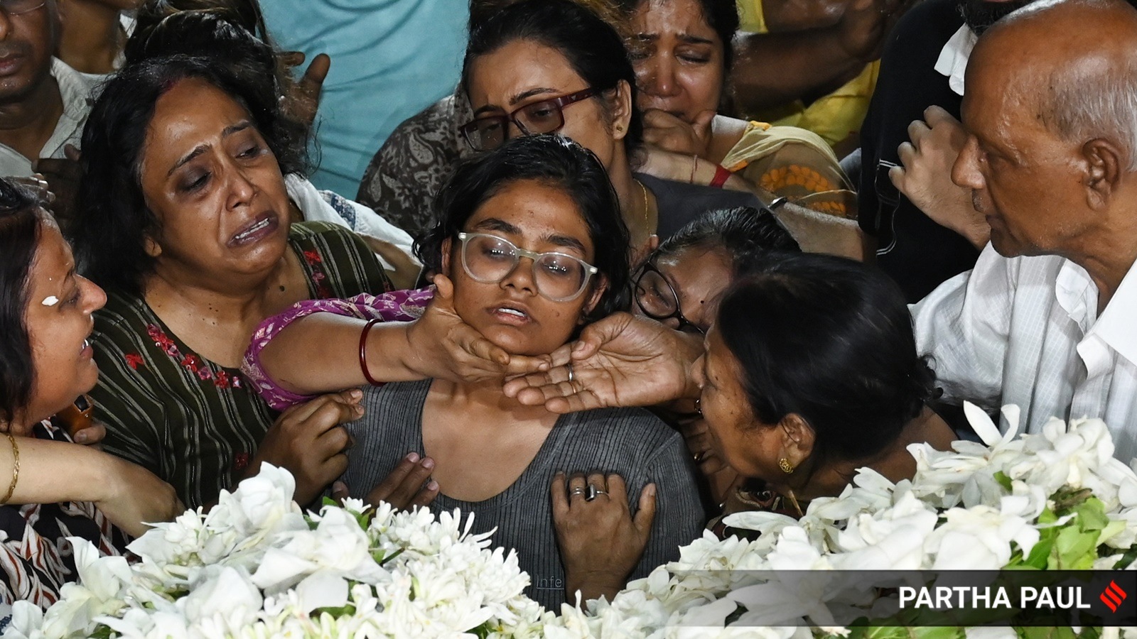 The wife and daughter of Sameer Guha, who was among the 26 killed by terrorists in Pahalgam, pay their last respect in Kolkata on Wednesday