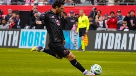 Inter Miami forward Lionel Messi (10) takes a freekick against the Chicago Fire during the second half of an MLS soccer game Sunday, April 13, 2025, in Chicago. (AP Photo)
