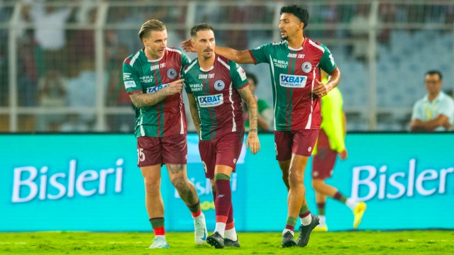 Mohun Bagan's Jason Cummings celebrating with team mates Jamie Maclaren and Sahal Abdul Samad after scoring from the spot during the ISL 2024-25 Final at Vivekananda Yuba Bharati Krirangan Stadium, Kolkata on Saturday. (ISL media)