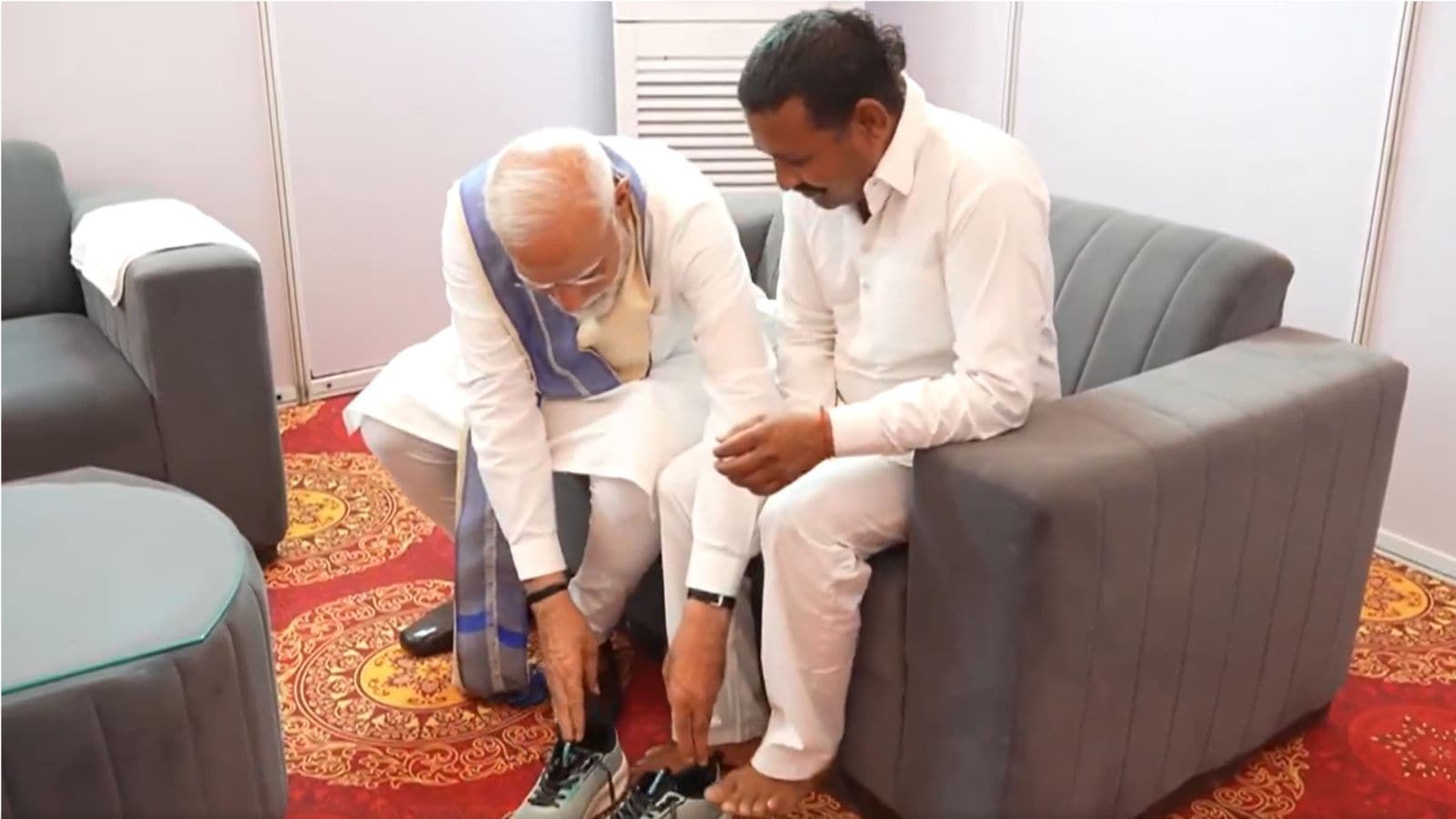 Watch: PM presents man shoes that walked barefoot for 14 years until he meets Modi | India News Watch: PM presents man shoes that walked barefoot for 14 years until he meets Modi | India News