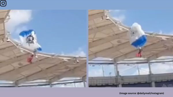 The parachuter is seen attempting a landing when a sudden gust of wind changes the direction of his parachute (Image source: @dailymail/Instagram)