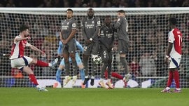 It was the shape of the Madrid wall, just four men screening the goalkeeper Thibaut Courtois that sparked the quick-witted Declan Rice’s imagination to screech the ball around the wall. (AP)