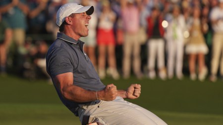 Golfer Rory McIlroy celebrates winning in a playoff against Justin Rose after the final round the Masters golf tournament. (AP)