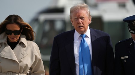 President Donald Trump and first lady Melania Trump head towards AIr Force One at Joint Base Andrews in Maryland for the trip to Italy, where they are to attend the funeral of Pope Francis, on Friday morning, April 25, 2025. (Eric Lee/The New York Times)