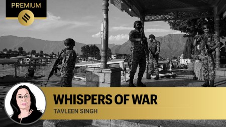 Paramilitary soldiers stand guard at the banks of Dal Lake as tourists take boat rides in Srinagar on Friday. Security has been steeped up in the region following the Pahalgam attack,