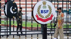 BSF and Pakistani Rangers soliders stand guard at Attari-Wagah international border. (PTI File Photo)