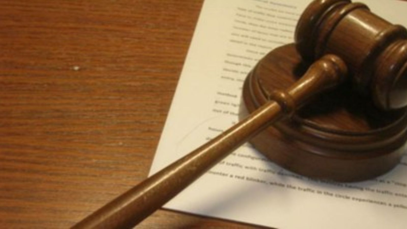 Usually in a criminal court, an accused sits in an enclosure at the far end of the courtroom, and witnesses depose from the witness box, which is close to the bar, where lawyers make their submissions.