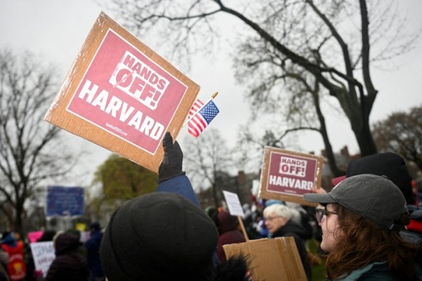 Demonstrators rally at a protest organised by the City of Cambridge, calling on Harvard to resist interference by the federal government in Cambridge, on April 12.