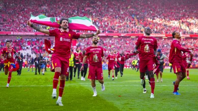 Liverpool's players celebrate after winning the English Premier League match against Tottenham Hotspur which helped them clinch the Premier League title at Anfield. (AP Photo)