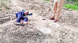 mohali (1) An injured gangster lying on the ground with spent cartridges marked with chalk circles. Express