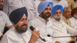Congress leader Partap Singh Bajwa, with Punjab Congress President Amrinder Singh Raja Warring, adressess a press conference at the party office, Chandigarh, Tuesday, April 15, 2025. (PTI Photo)