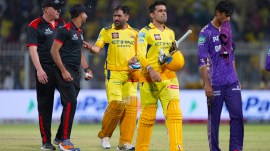 CSK captain Mahendra Singh Dhoni, center, and batting partner Anshul Kamboj leave the field at the end of the Indian Premier League cricket match between Kolkata Knight Riders and Chennai Super Kings at Eden Gardens in Kolkata, India, Wednesday, May 7, 2025. (AP Photo)